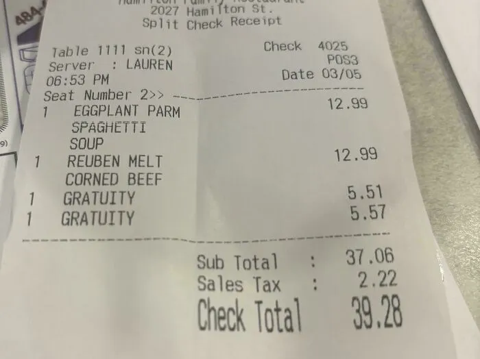 A restaurant receipt shows a split check with gratuity already included, highlighting issues in tipping culture.
