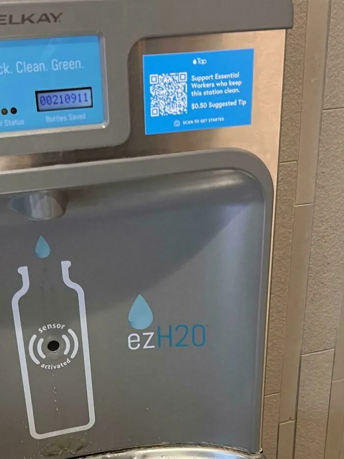 Water dispenser with a QR code suggesting a $0.50 tip for essential workers, part of the debate to end tipping culture.