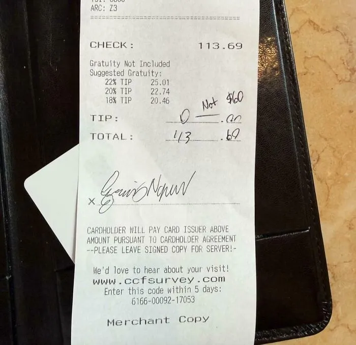 A restaurant receipt with zero tip written, demonstrating a customer's decision regarding tipping culture and the need to end tipping.