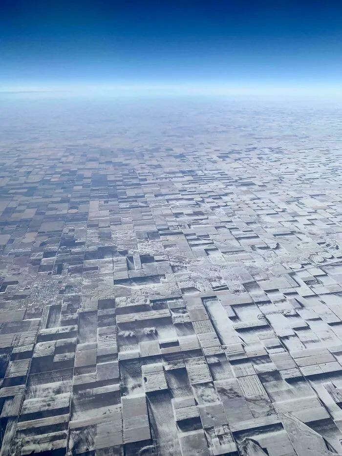 This Is 100% Flat Farmland. Several Years Ago I Snapped This Pic Out Of The Plane Window In Eastern Co. The Snow Drifts And Melt On The Crops Had Created An Illusion Of Endless Cubism