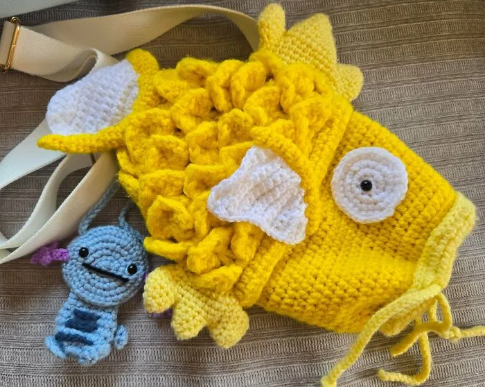 Yellow crochet fish hat and small crochet creature keychain