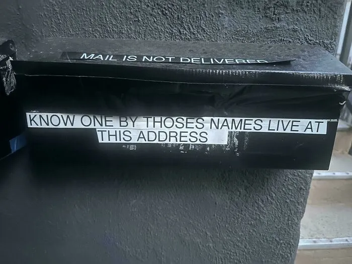 Airbnb blunder: A mailbox with a sign indicating mail is not delivered at this address.