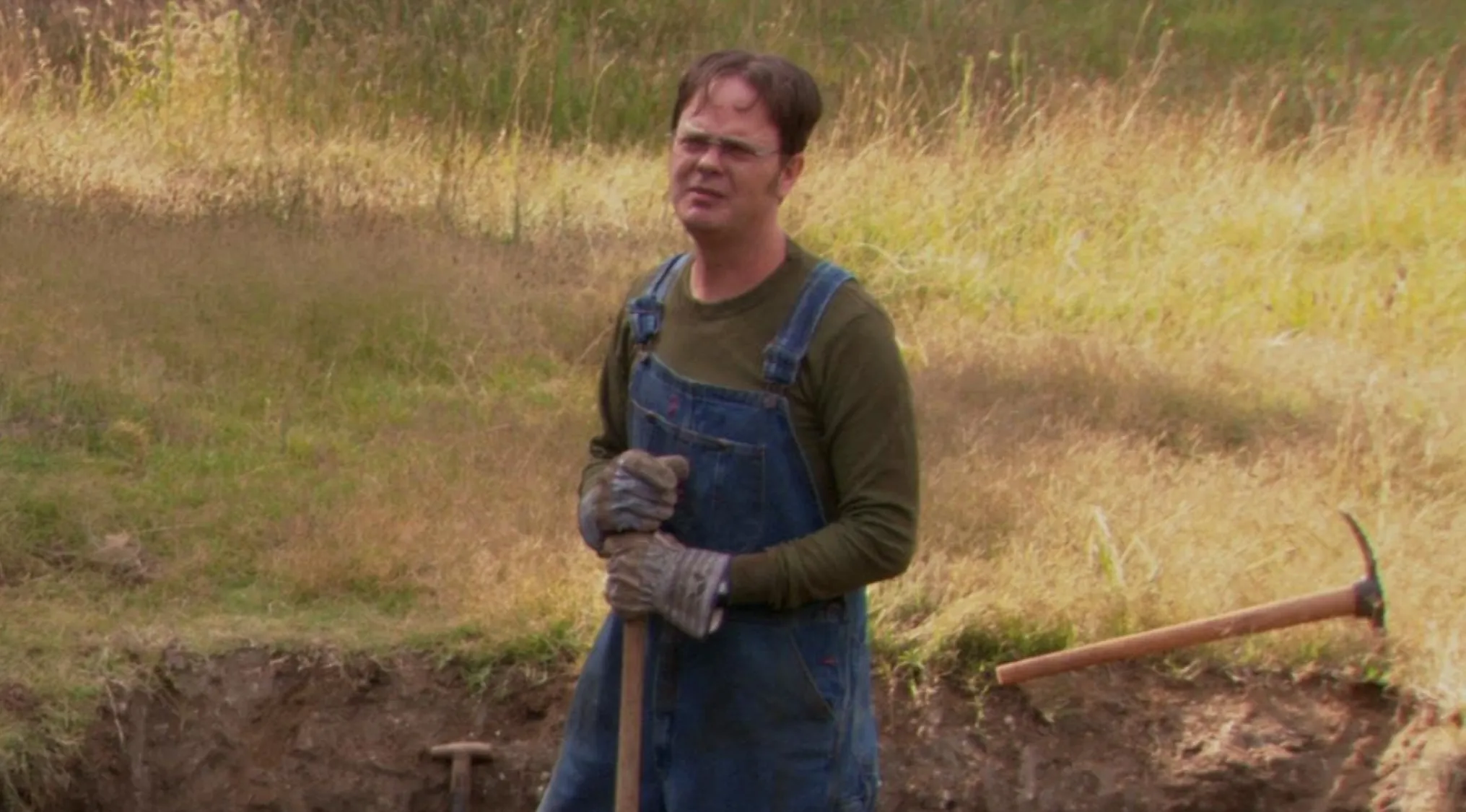 2000s pop culture, Dwight Schrute from The Office working on his family farm.