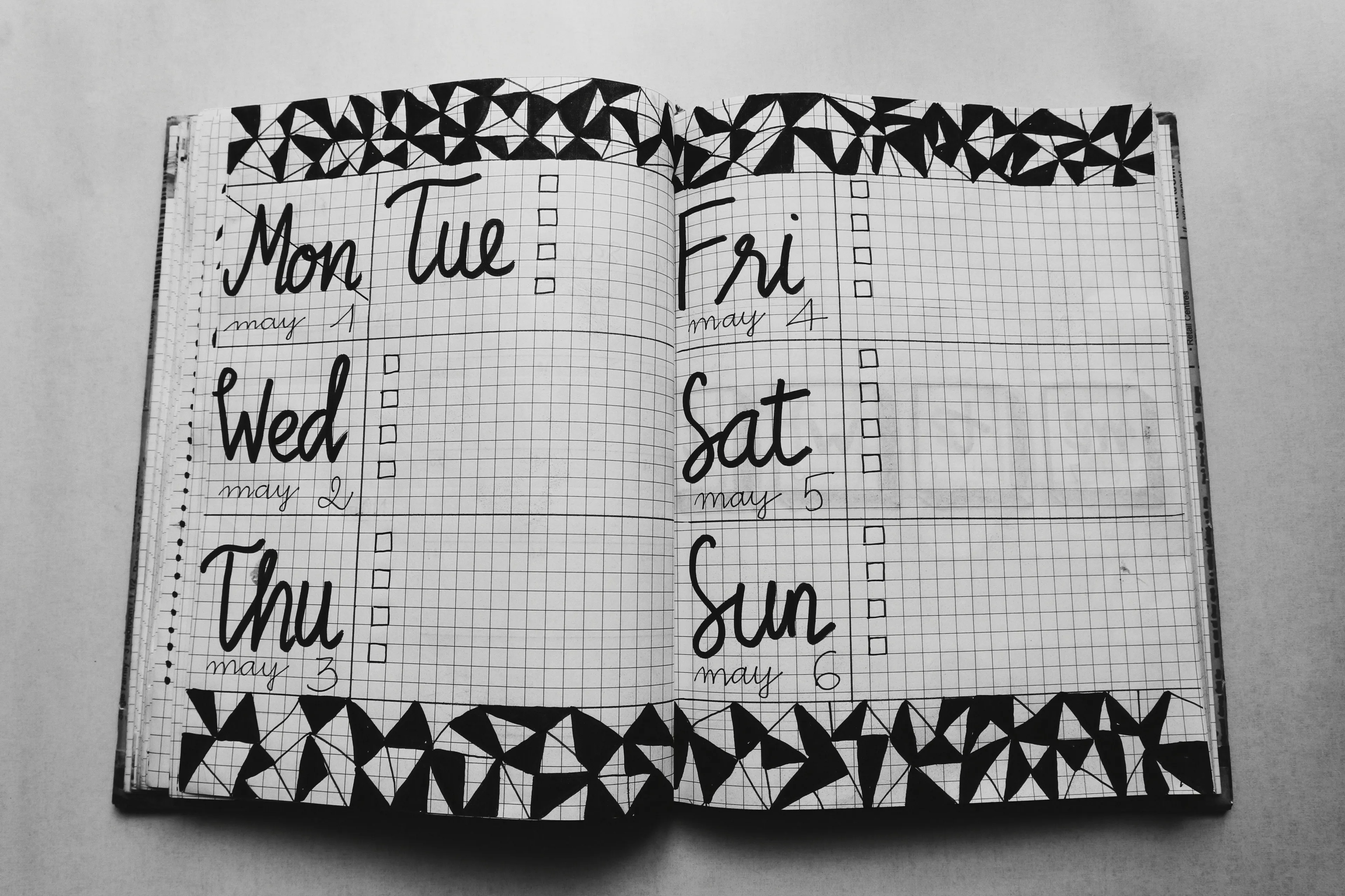 A weekly planner with days and checkboxes, symbolizing a successful week in ancient Rome.