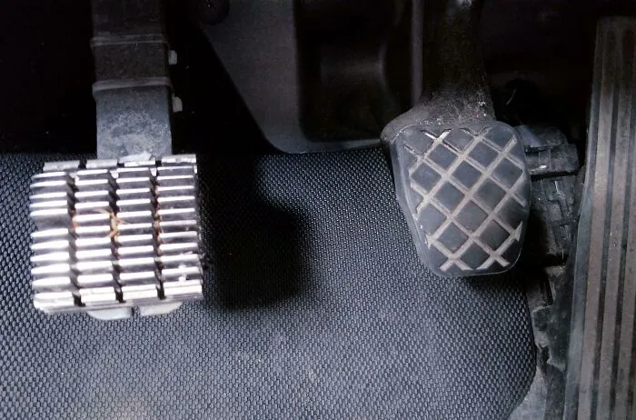 A wild and unhinged way to fix a car pedal with a metal cover over the original pedal.