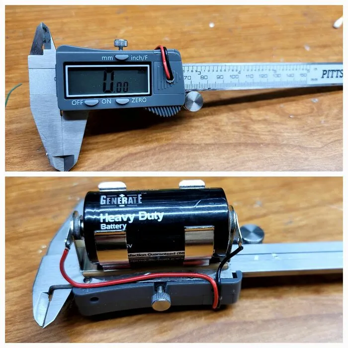 Digital calipers being used as a battery holder, a wild and unhinged way to fix something.