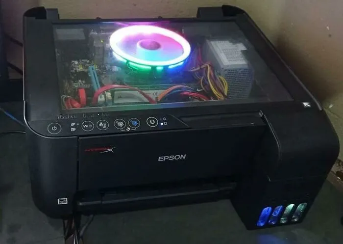 Wild and unhinged fix: a computer tower built into an Epson printer with a glowing fan.