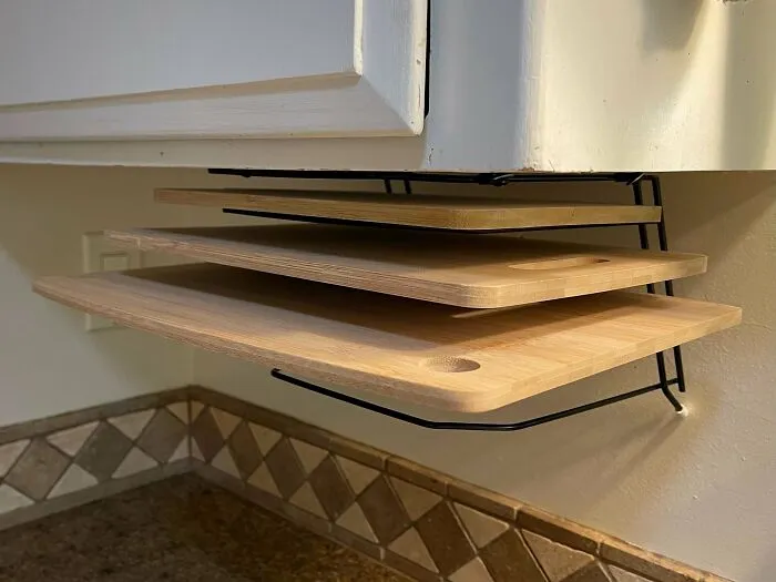 Used To Be A Desktop File Folder Holder, Purchased For 50 Cents At A Garage Sale. Is Now An Under-Cupboard Rack For Lightweight Bamboo Cutting Boards (With Room For Five Of Them). Handy To Grab, No Counter Space Taken, And They Dry Better After Washing