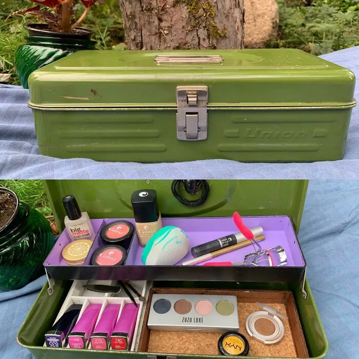 A green metal toolbox repurposed into a makeup organizer, demonstrating creativity turning old junk into storage.