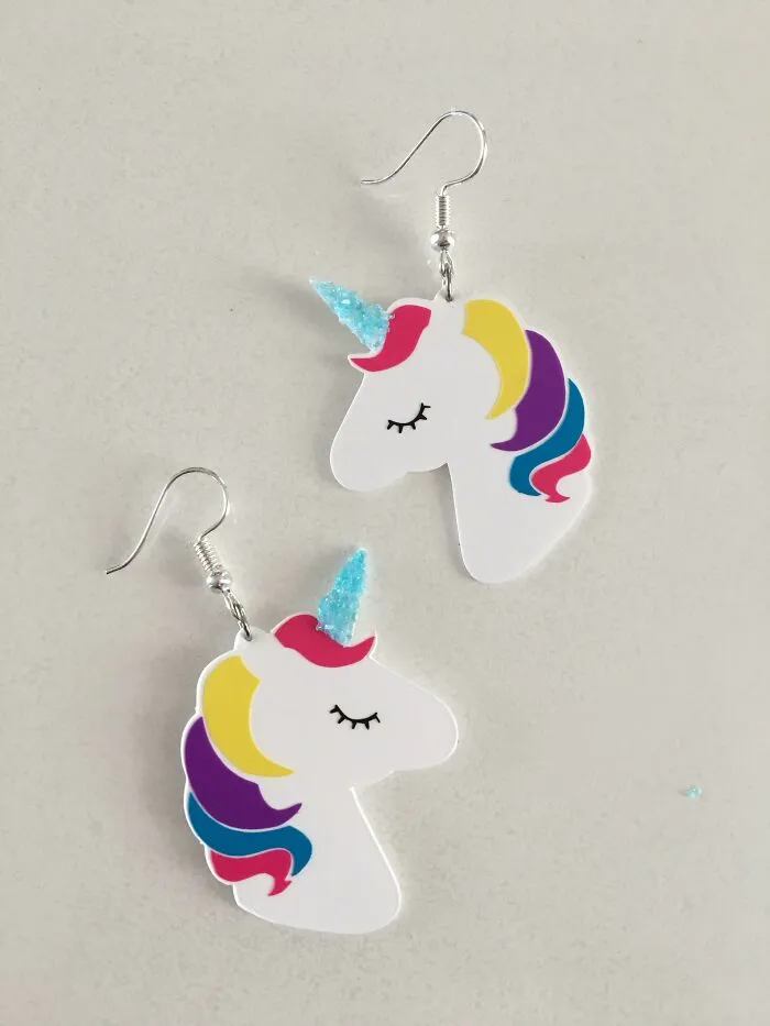 A pair of adorable unicorn earrings, showing how creativity can turn simple materials into something worth keeping.
