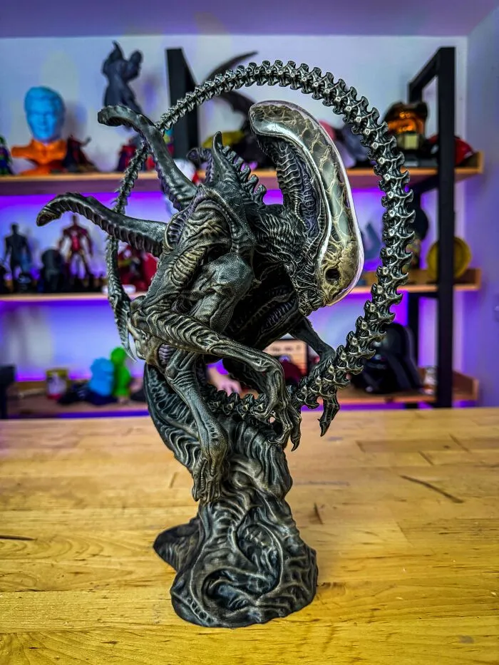 An intricate 3D printing of an Alien Xenomorph statue, surrounded by a skeletal ring, amazing creations.