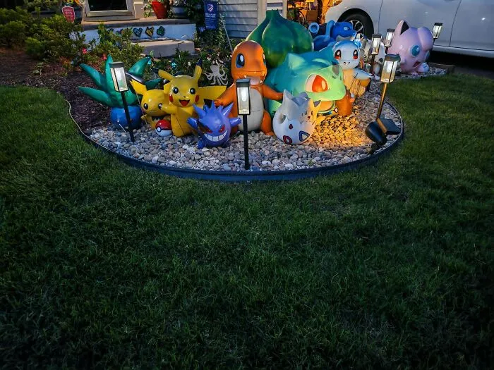 Amazing 3D printing creations: large Pokémon figures like Pikachu, Charmander, and Bulbasaur displayed in a garden.
