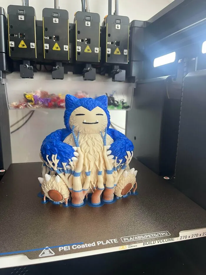 Amazing 3D printing creation of a large, detailed Snorlax figure being printed on a 3D printer.