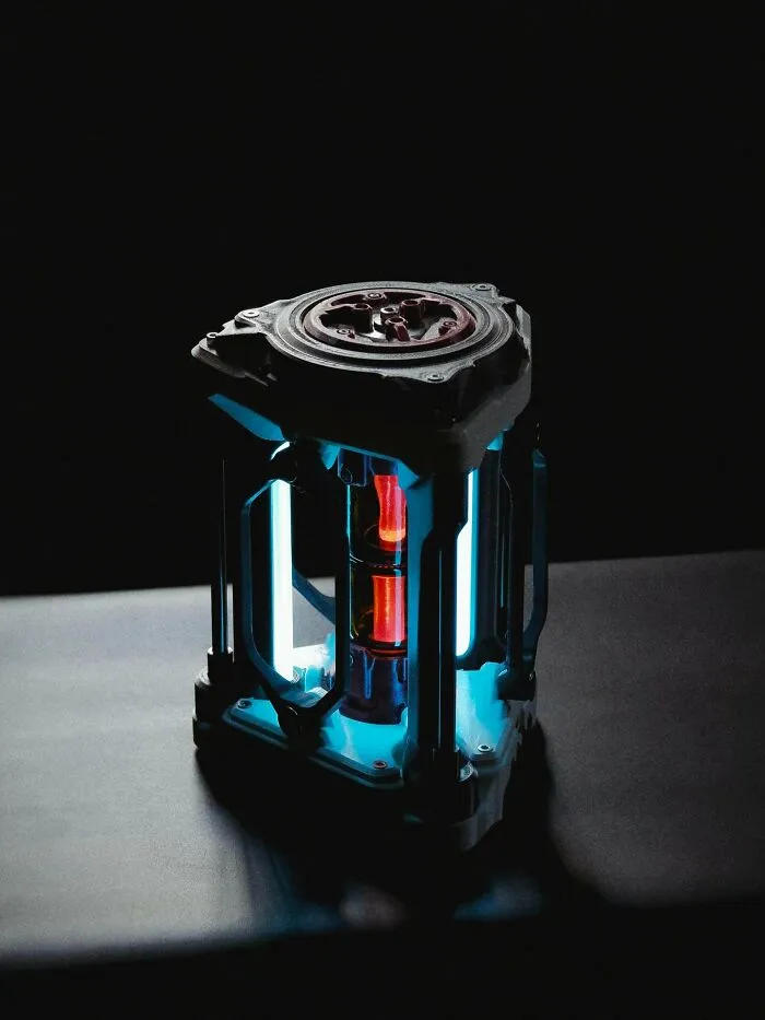 Amazing 3D printing creation of a glowing sci-fi energy core with blue and red lights.