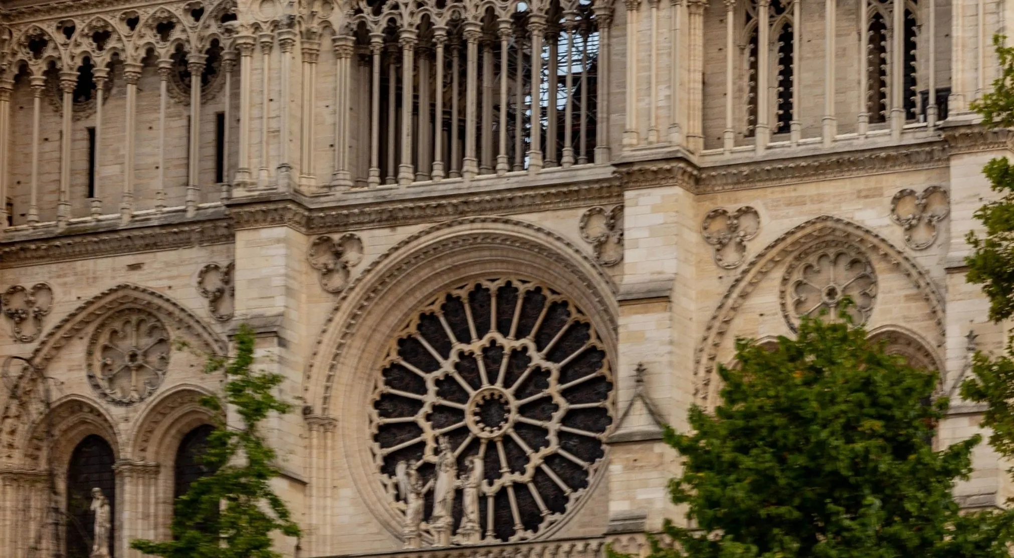 Close-up of a Gothic architectural landmark with intricate carvings and a large rose window. Zoomed in landmarks challenge.