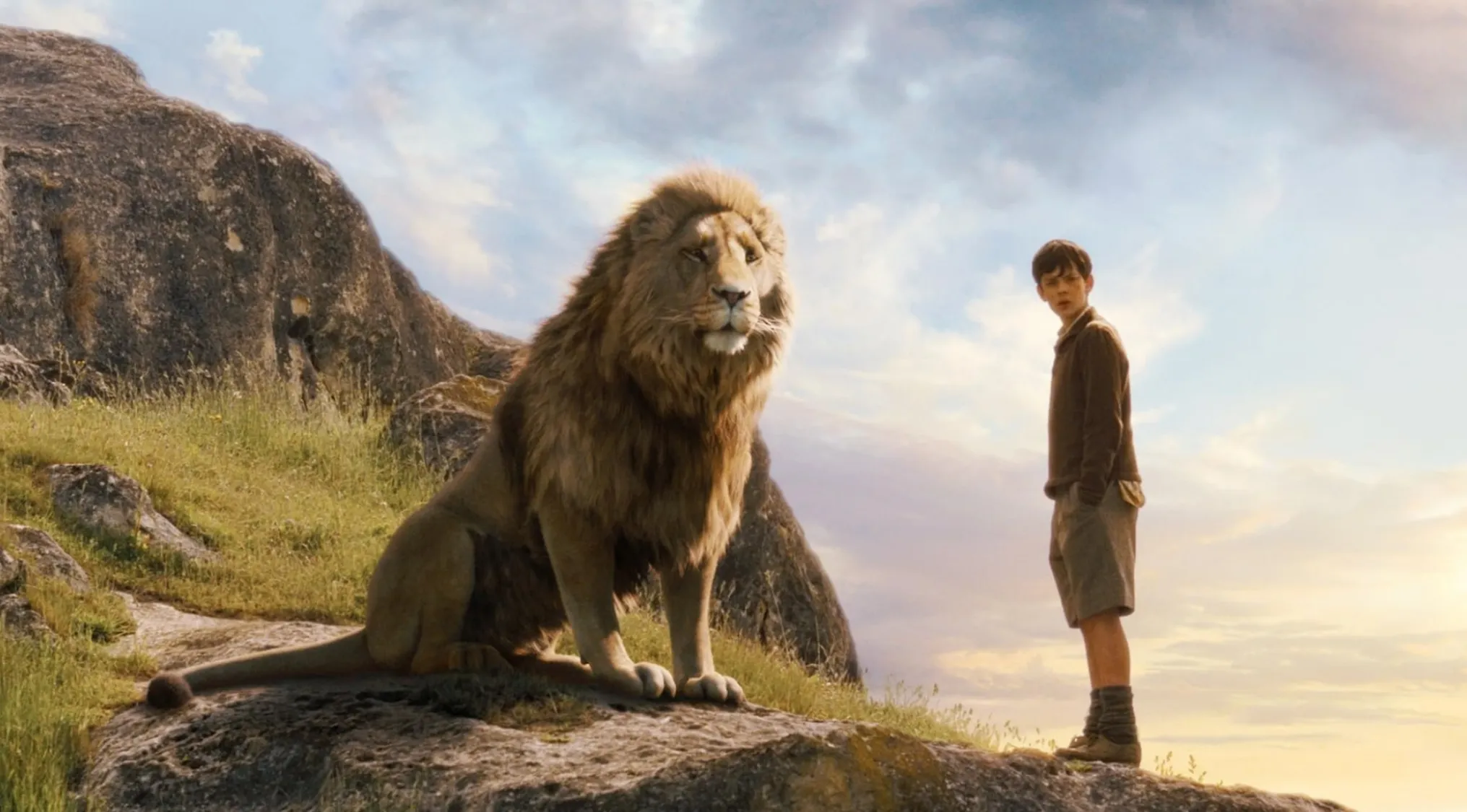 A majestic lion and a boy from a movie franchise, asking to spot the movie subtitle that doesn't fit.