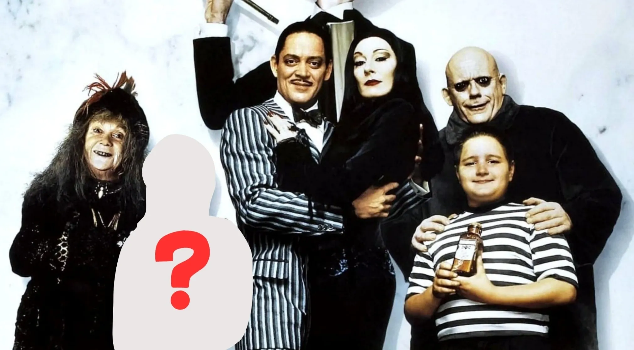 An Addams Family portrait with a blank, ghost-like figure and a red question mark where a family member should be.