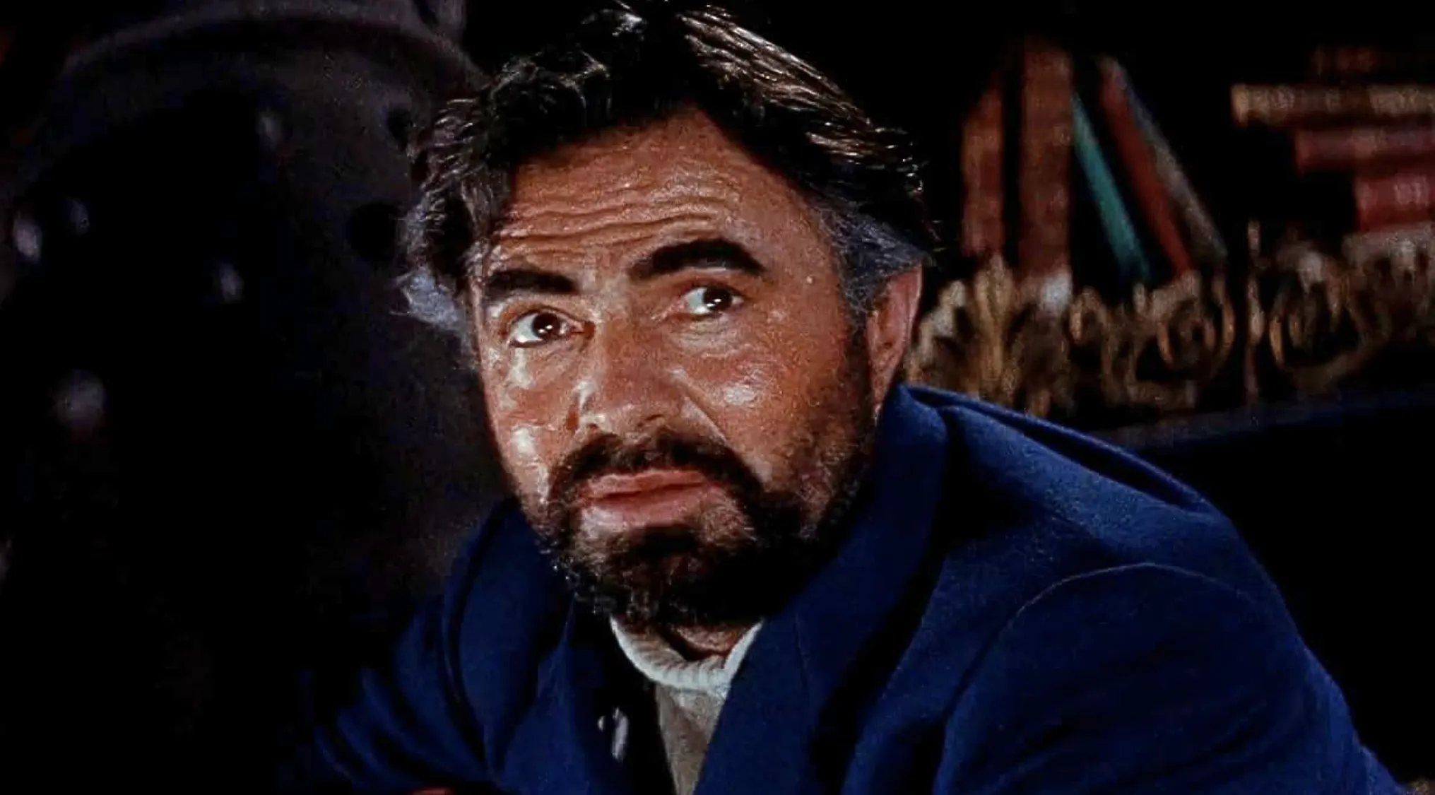 A man with a beard and dark hair, Captain Nemo, looking intently at the camera.