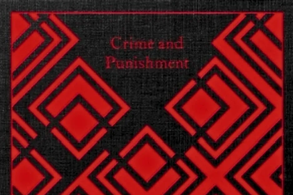 The cover of the book Crime and Punishment, featuring a black background with red geometric patterns.
