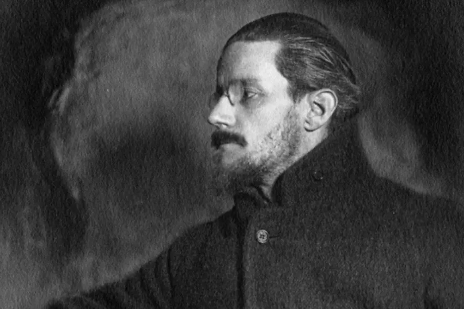 Black and white profile of James Joyce, a Nobel Prize in Literature author, with glasses and a beard.