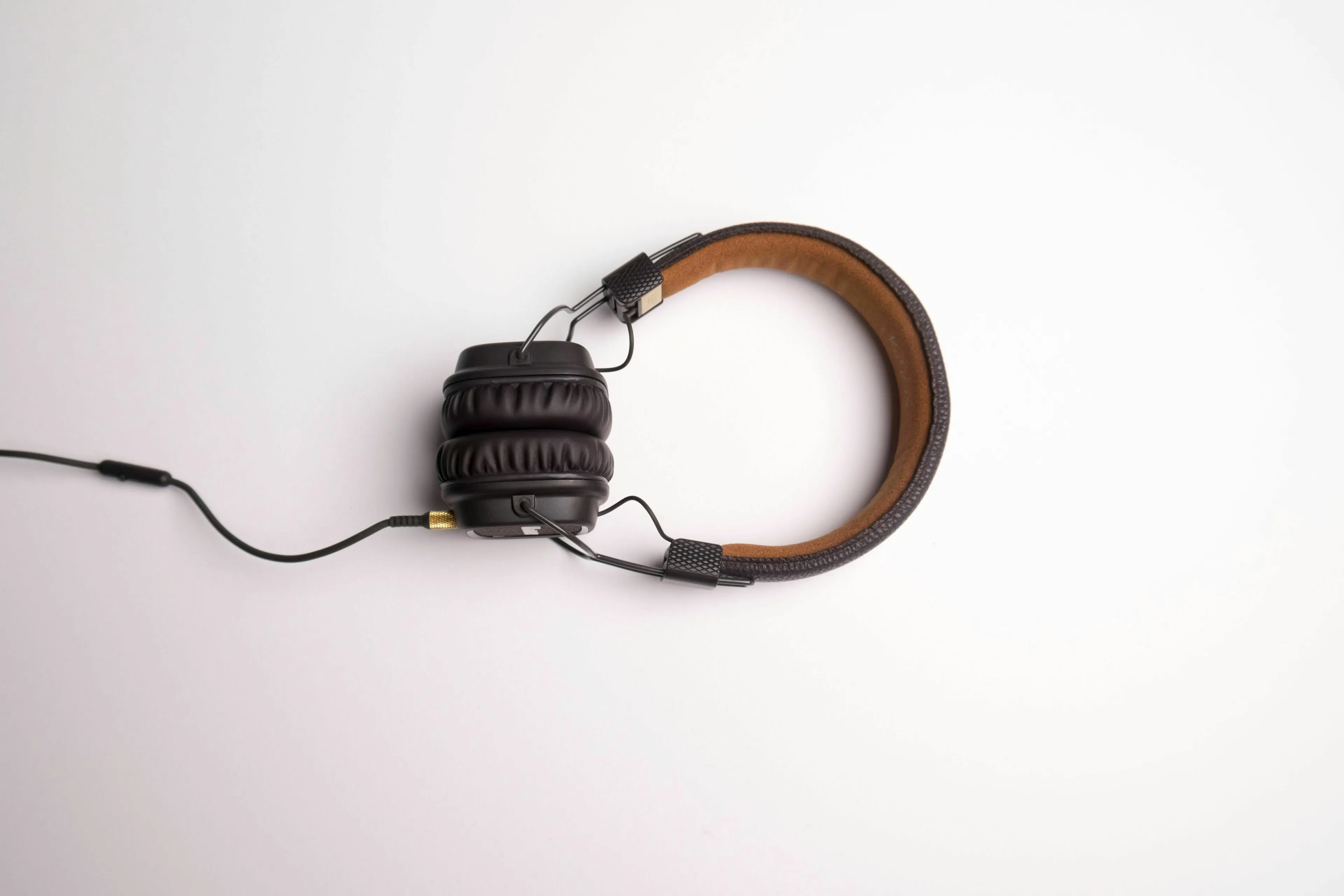 A pair of black and brown headphones, illustrating the main SEO keyword: sound.