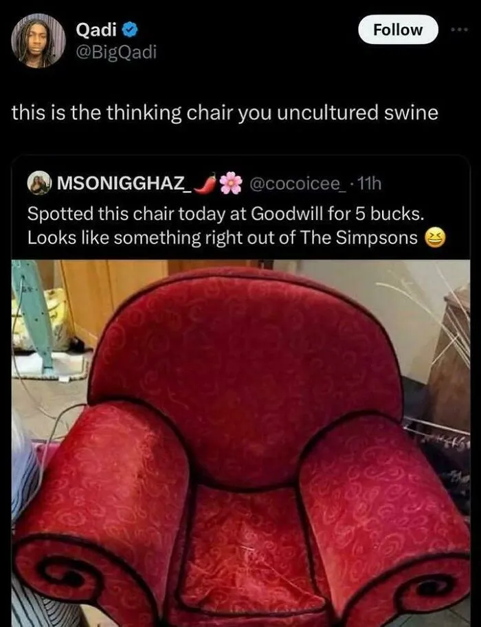 A red upholstered armchair, a common piece of furniture from life in the 90s.