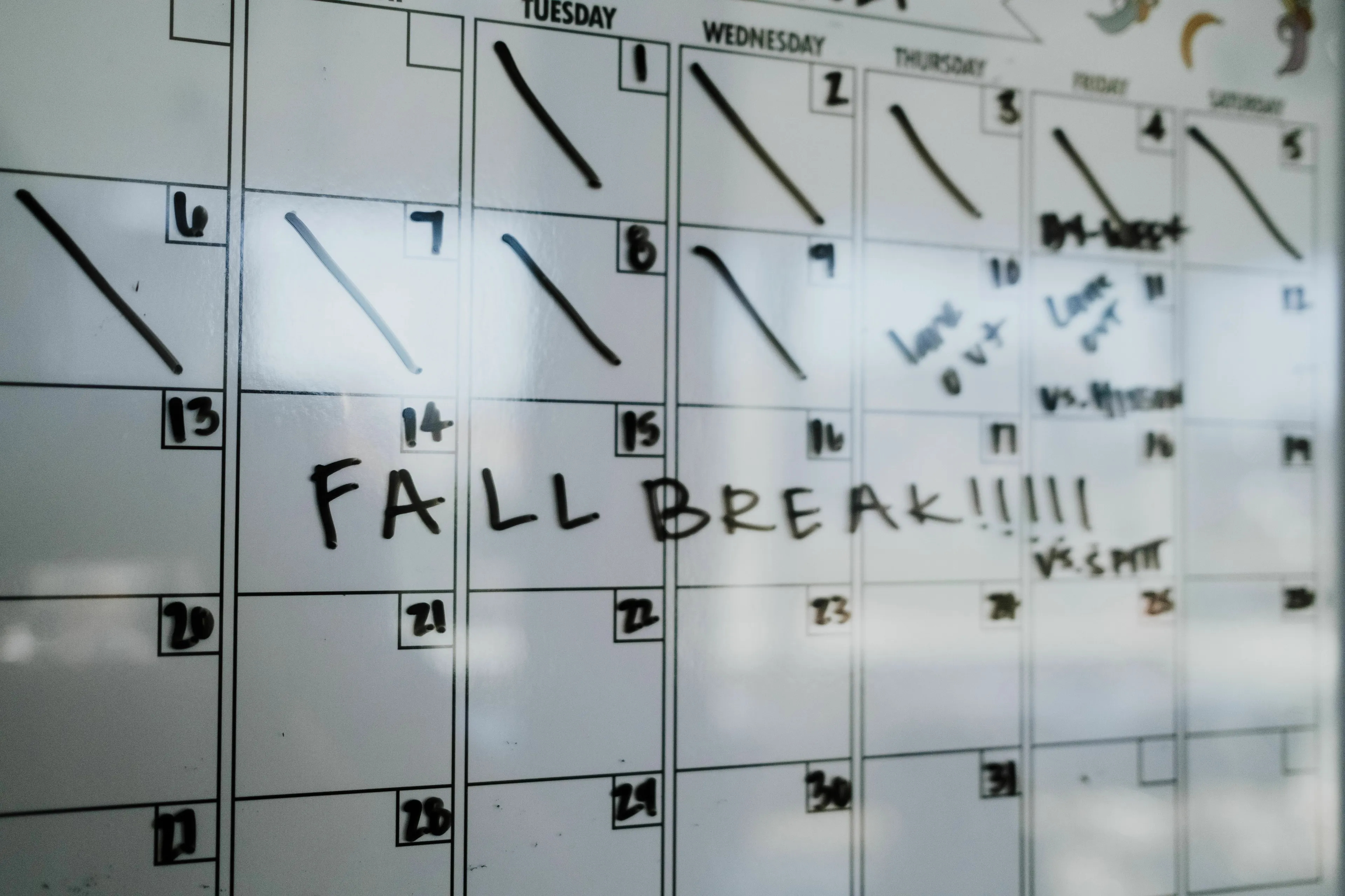 A whiteboard calendar with Fall Break written, representing a movie villain's plan coming together.