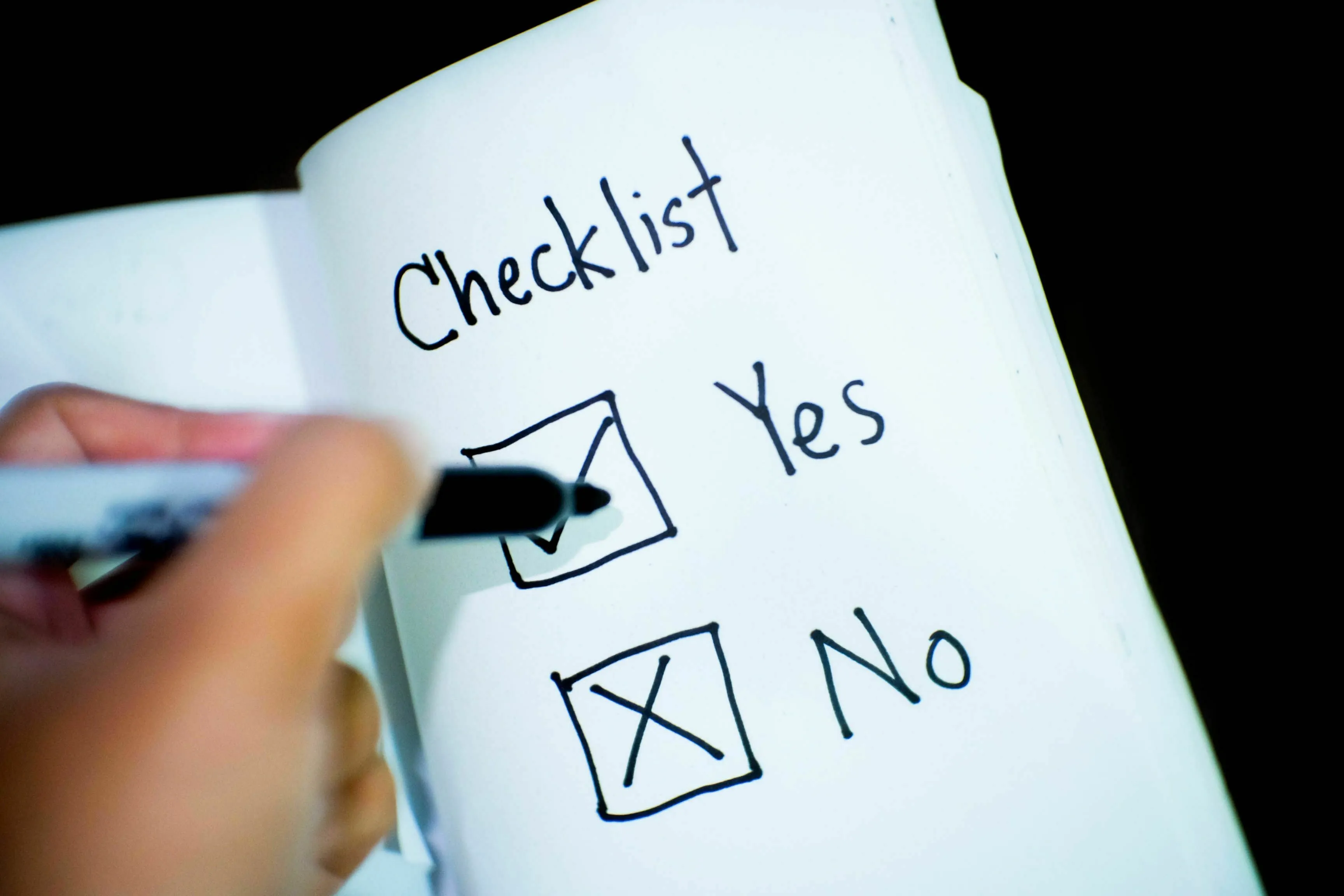 A hand checks a 'Yes' box on a checklist, symbolizing what a movie villain wanted before everything.