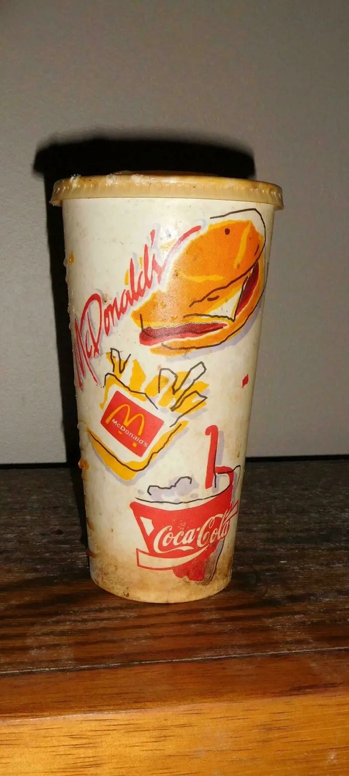 A vintage McDonald's paper cup with classic 90s branding, a nostalgic item that makes you feel like you went through a time machine.