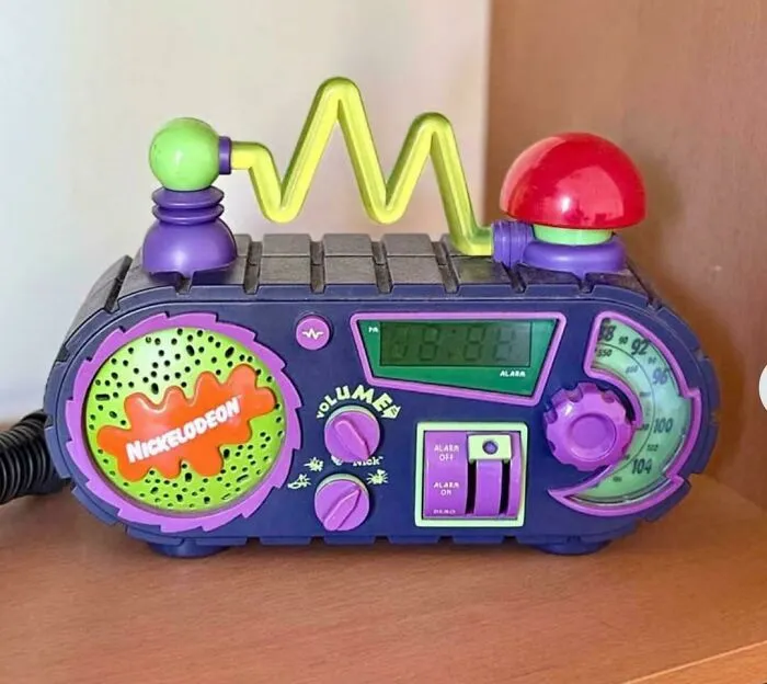 A colorful Nickelodeon alarm clock, a nostalgic item from life in the 90s.