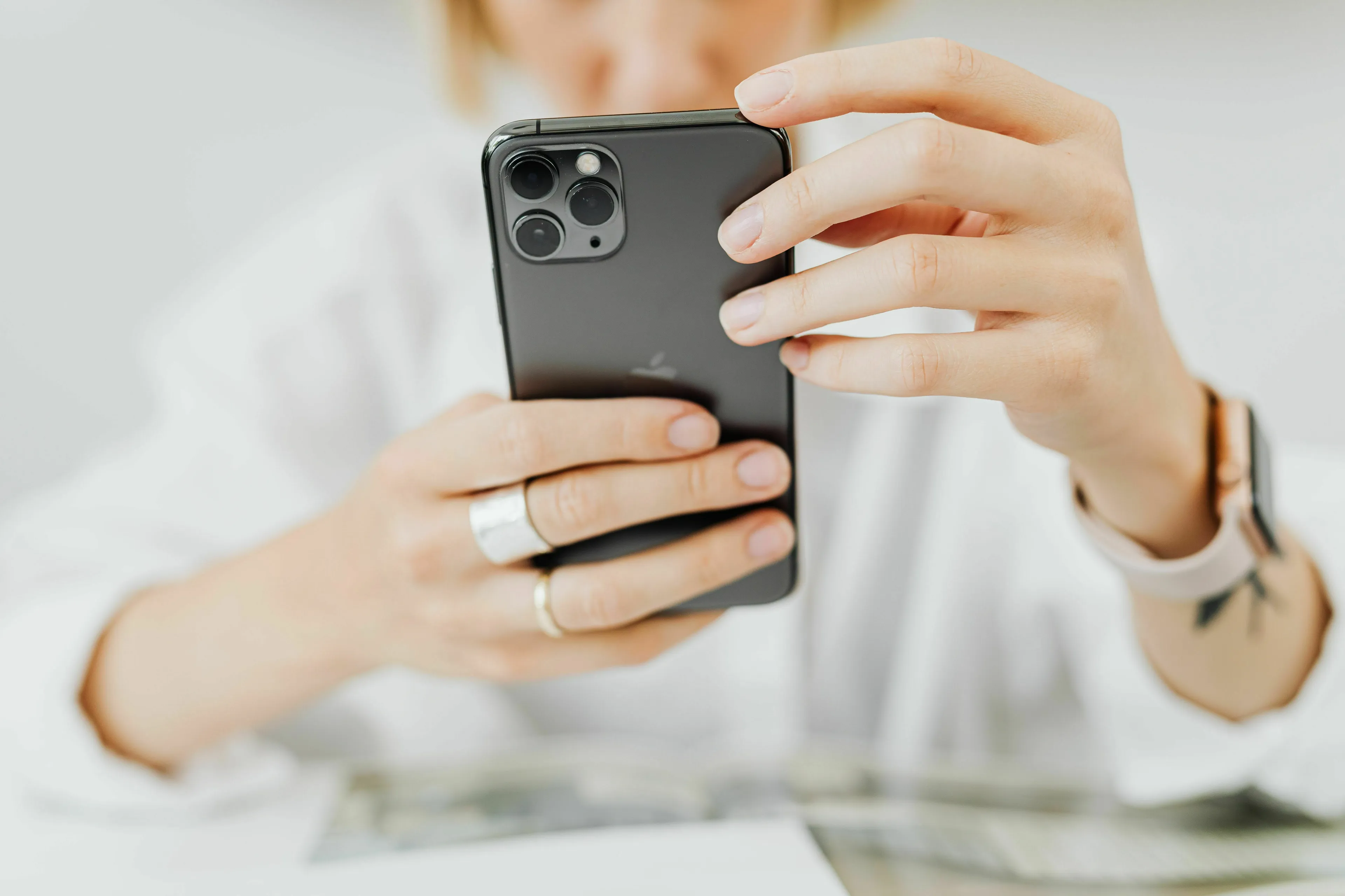 A person holding a phone, contemplating an unknown number. This image represents a stress response type.