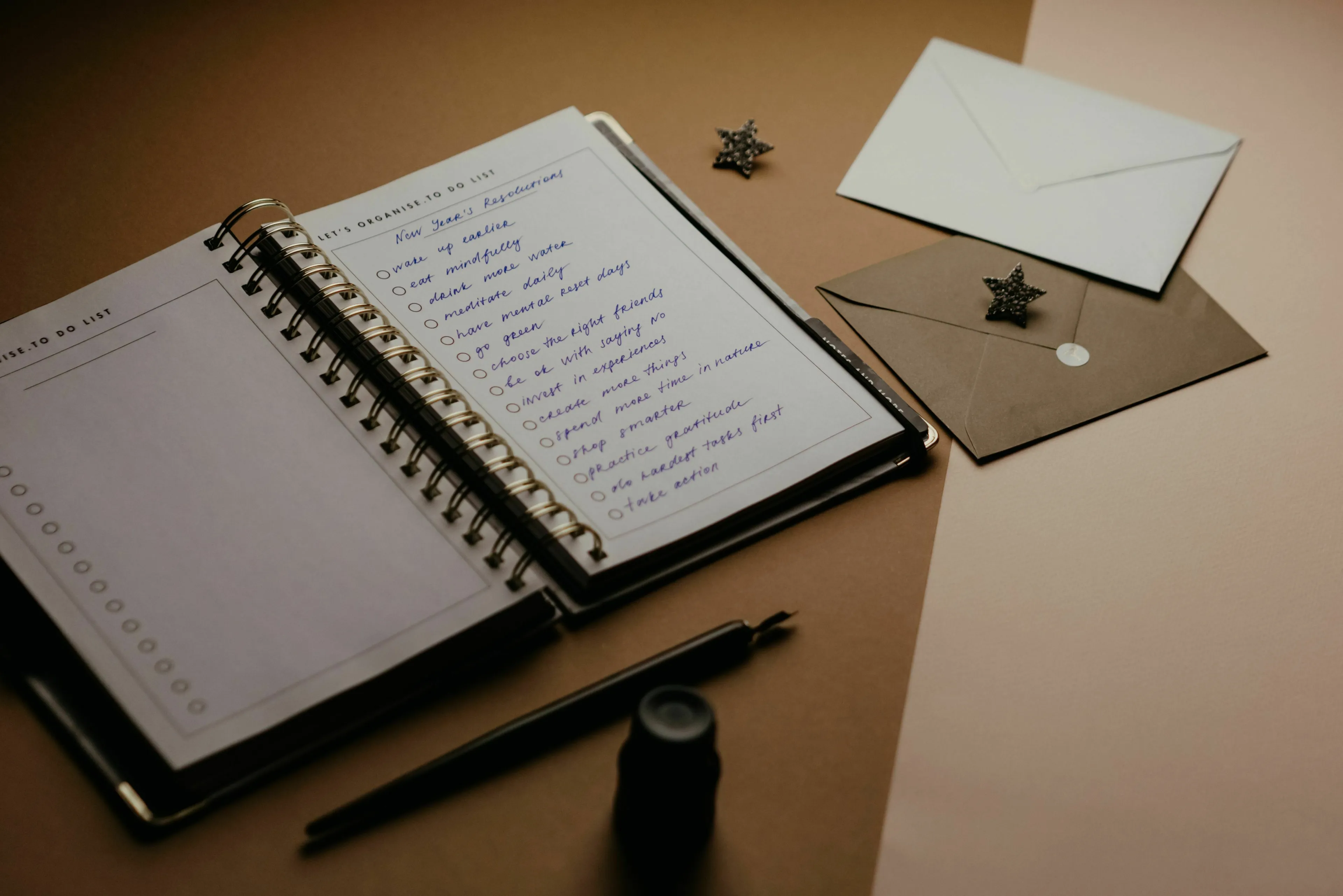 A notebook with a long to-do list and pen, illustrating how to handle a long to-do list and stress response type.