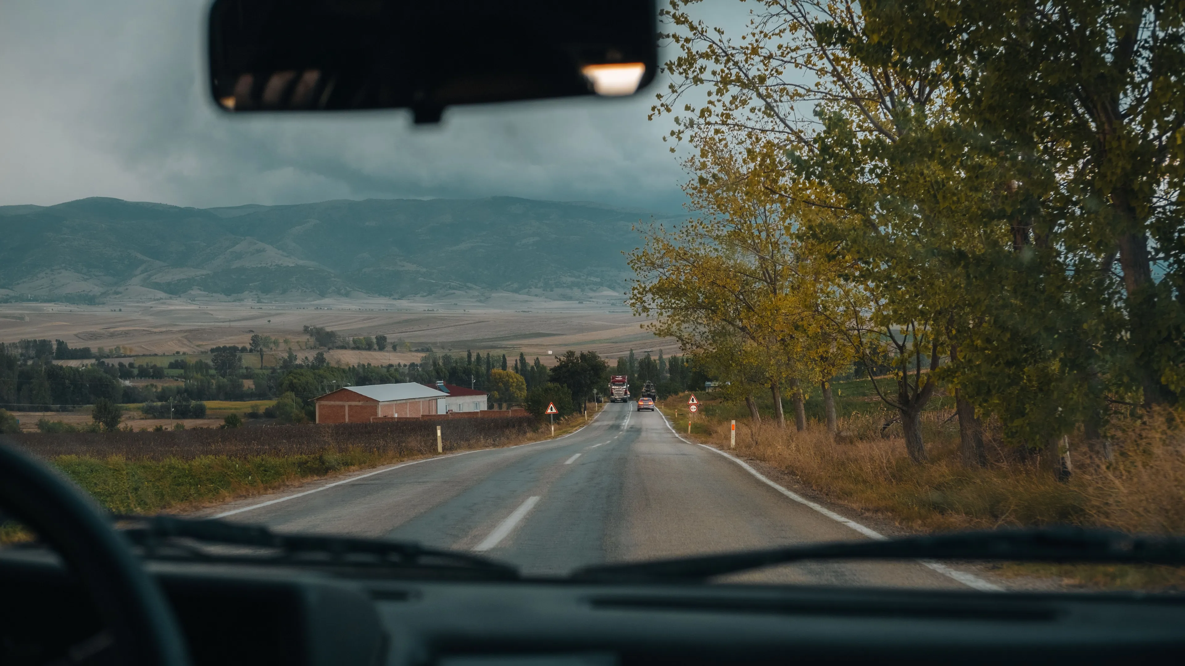 A view from inside a car on a road trip, picking a vacation spot.