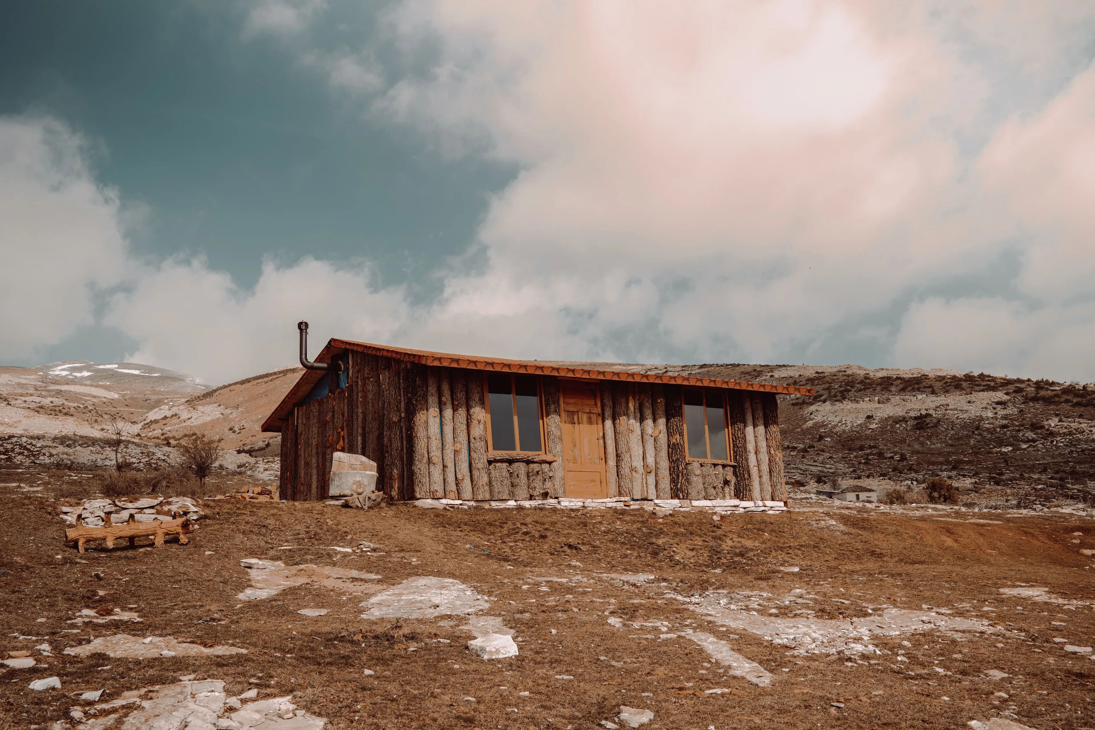 A remote cabin in a desolate landscape, a perfect vacation spot.