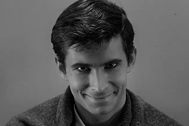A close-up of Anthony Perkins as Norman Bates in the iconic Hitchcock film Psycho.