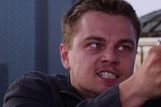 Leonardo DiCaprio portraying a character seeking revenge in The Departed, with an intense expression.