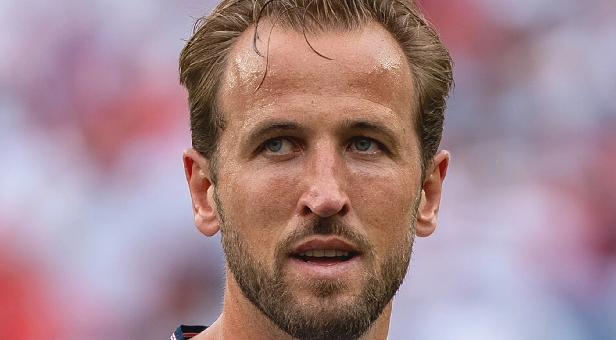 Close-up of a sweaty male football player looking up. FIFA World Cup Quiz, name this famous player.