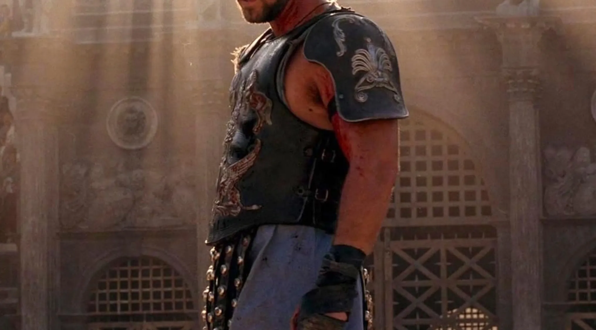 A close-up of Maximus in Gladiator, showing his battle-worn armor and a determined expression for a pub trivia quiz.