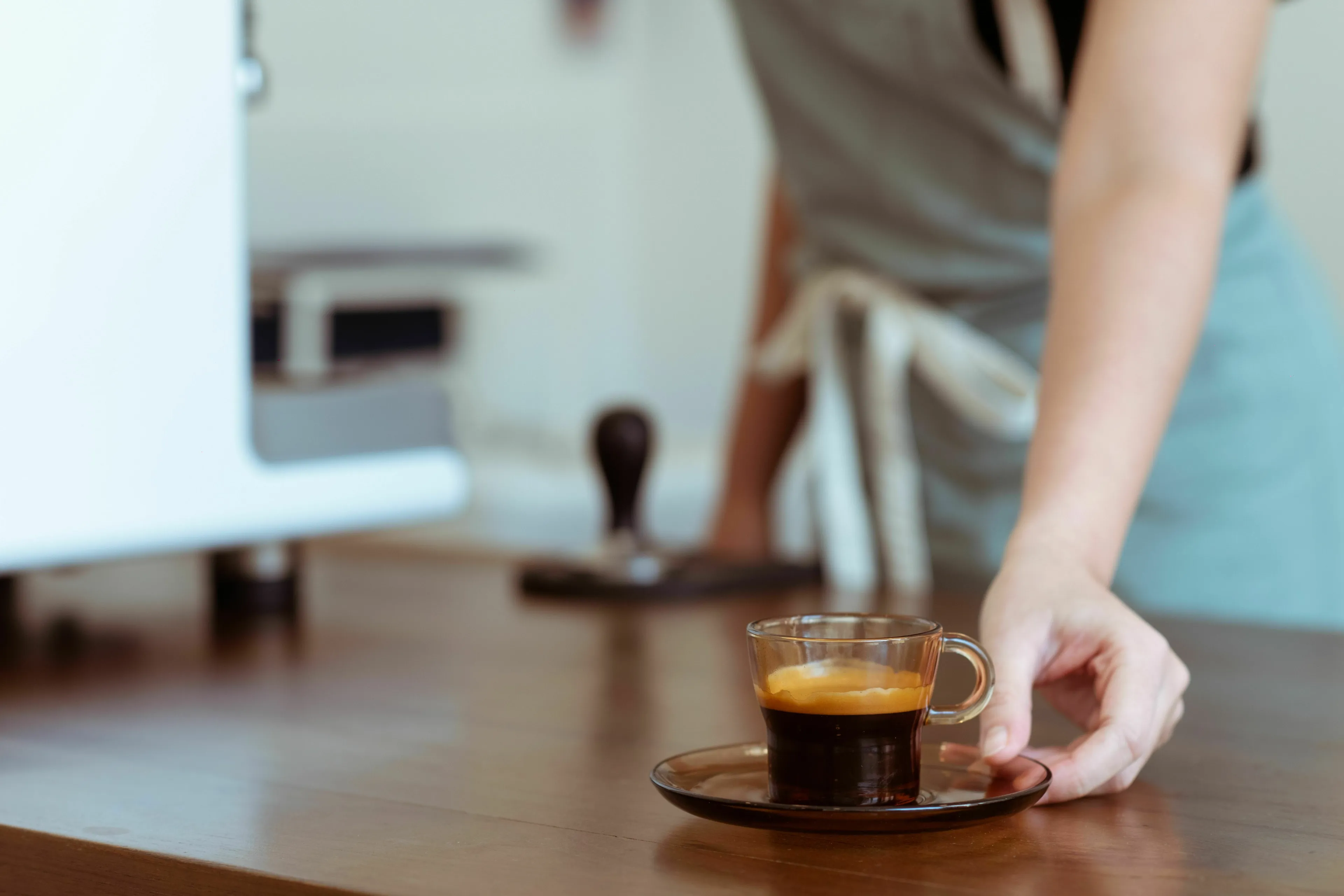 A barista serving a coffee order, highlighting the relationship with rules when an order comes out wrong.