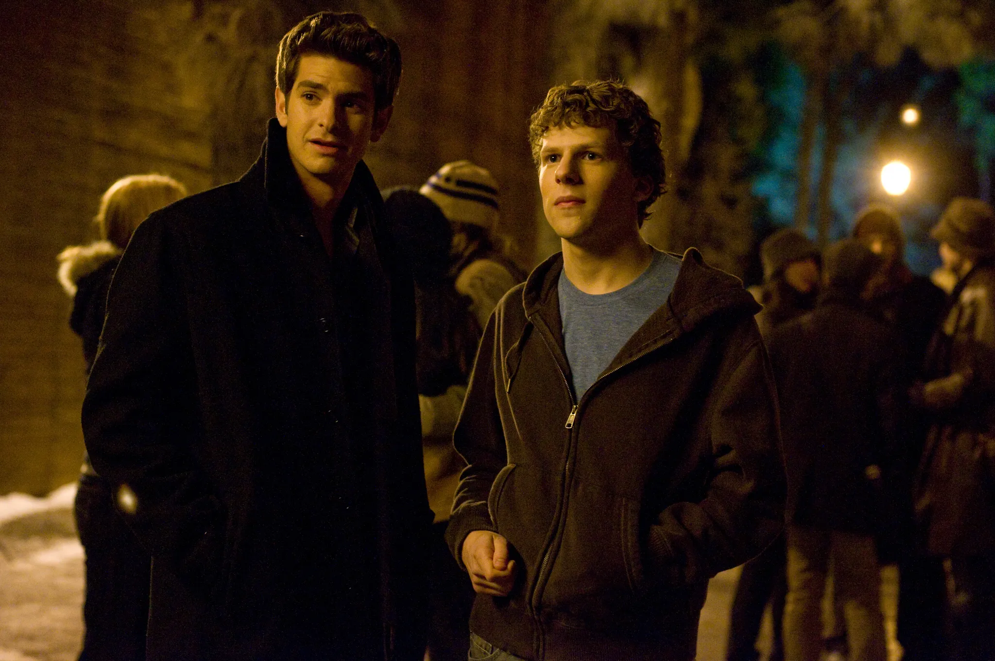 Mark Zuckerberg and Eduardo Saverin walk at night in The Social Network movie. Pick a movie for tonight.