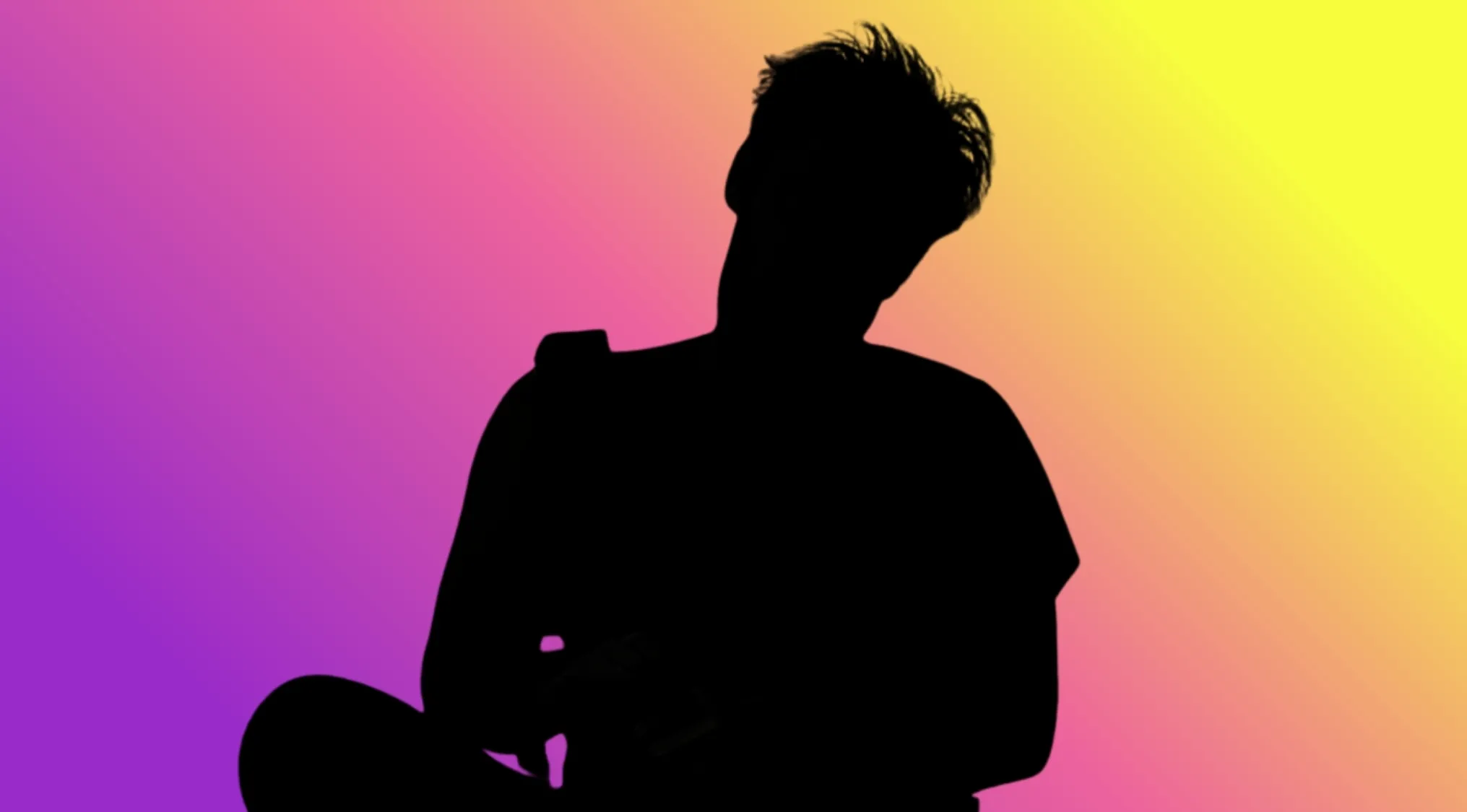 Character Silhouettes: Silhouette of a male character from a film against a vibrant background.