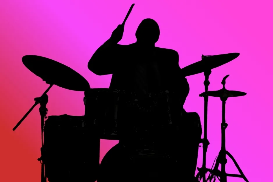 Silhouette of Kevin Malone playing drums, from The Office (2005), against a vibrant pink background.