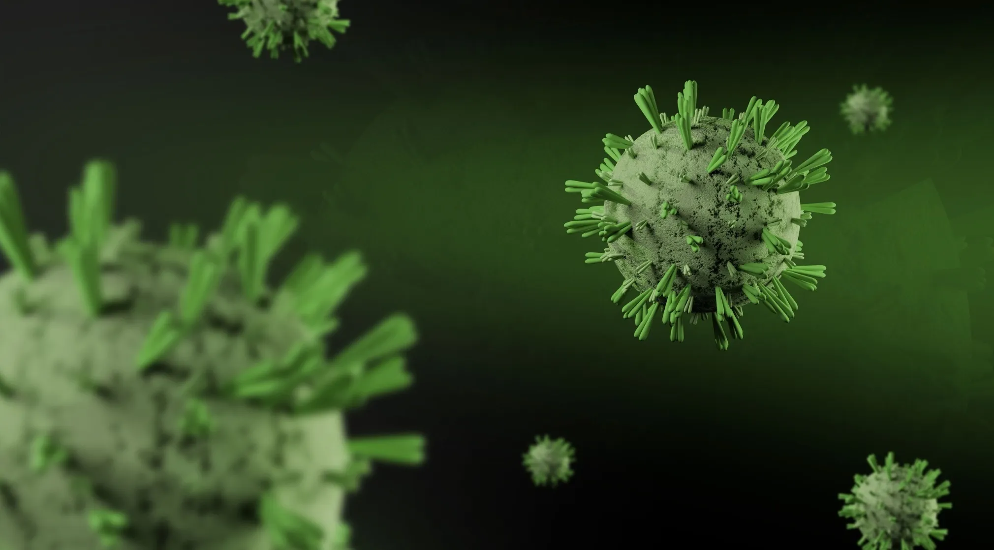 A microscopic view of green and grey disease cells, resembling a virus, floating against a dark green background.