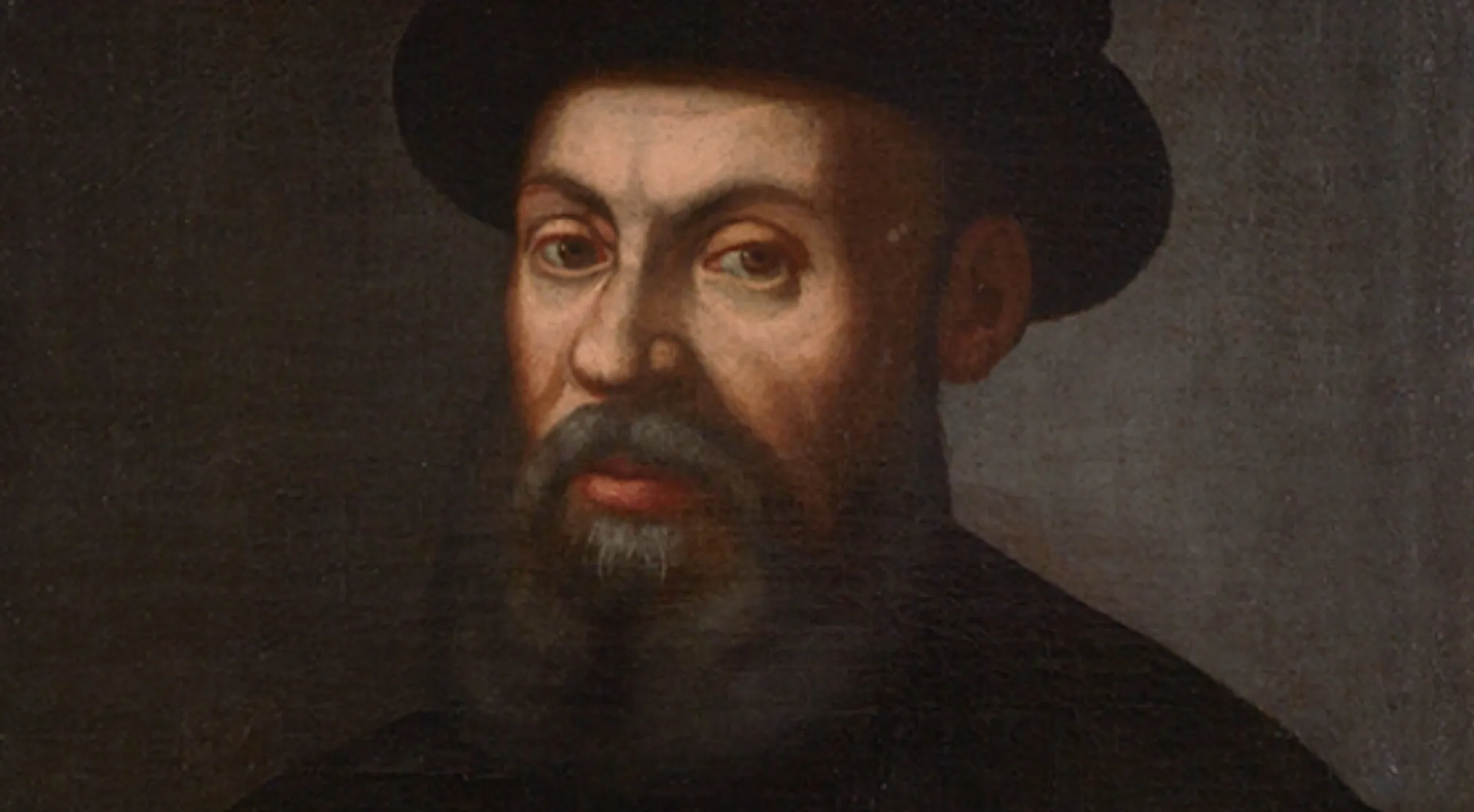 A painting of Ferdinand Magellan, a man with a beard and mustache, wearing a dark hat and coat. Jeopardy Quiz Oceans.