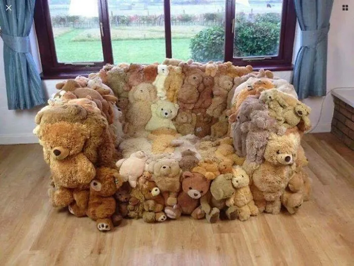 A sofa made entirely of various teddy bears, a crazy furniture design.