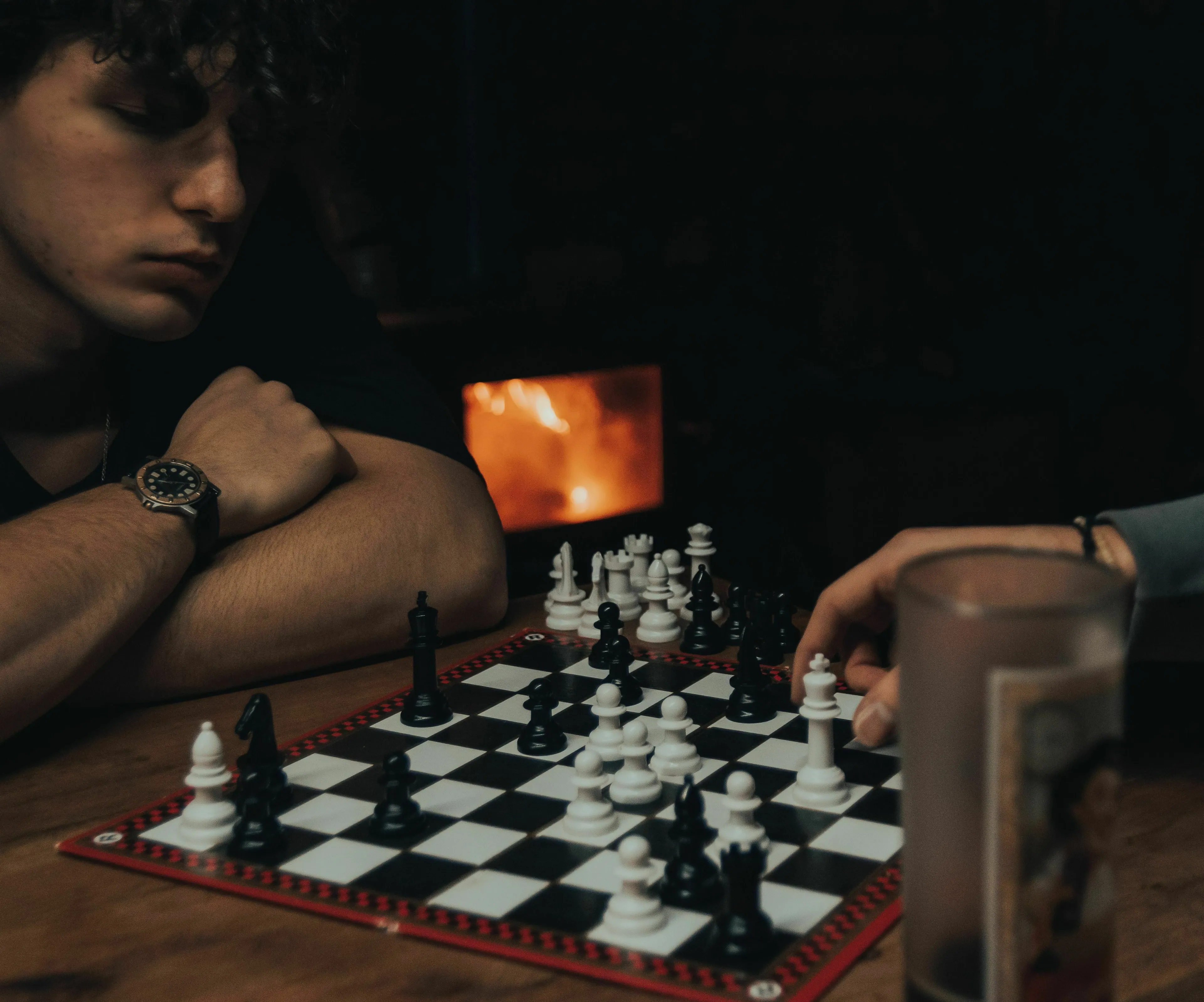 Two players engaged in a game of chess, highlighting a chess piece for a quiz question.