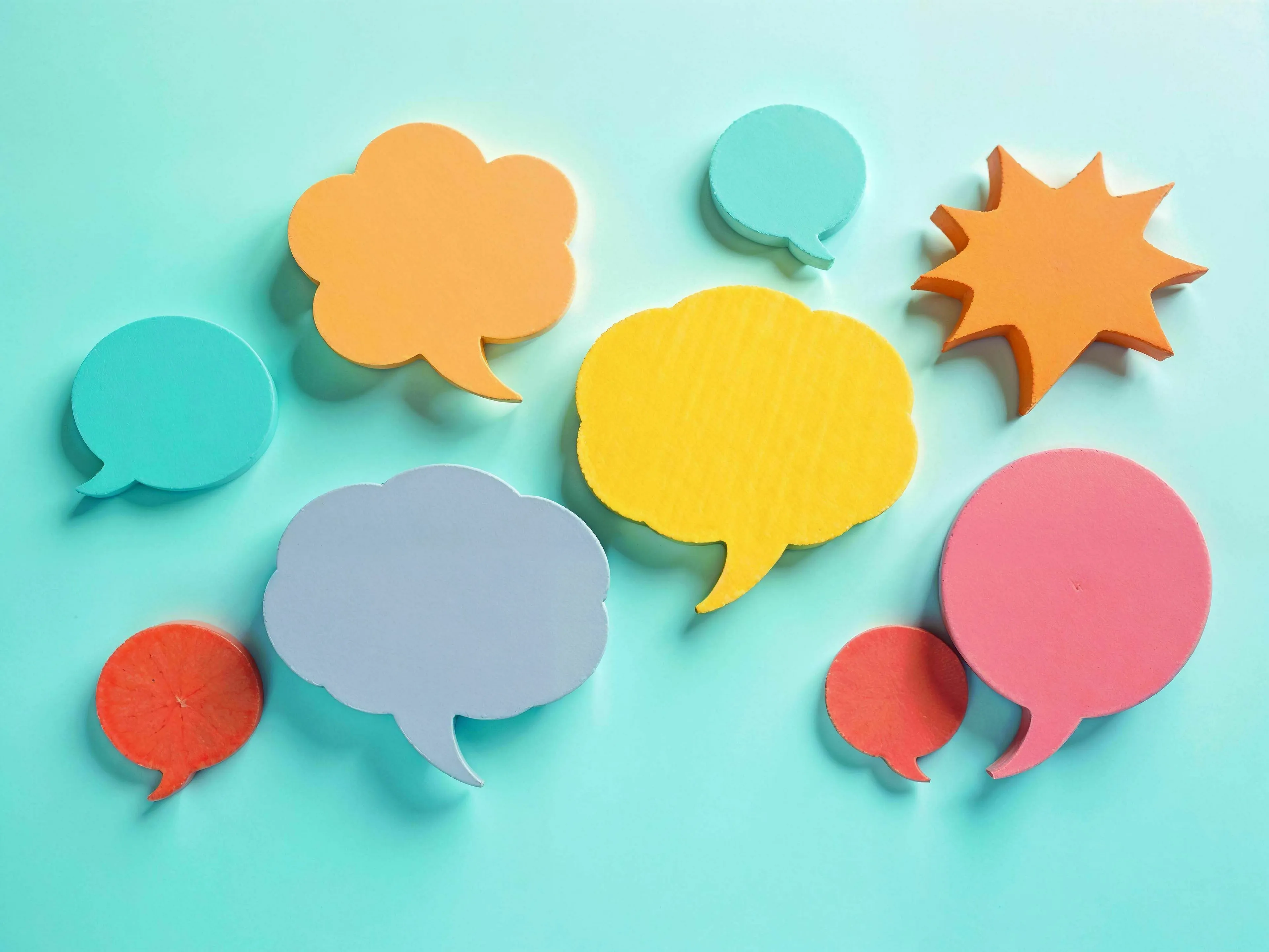 Colorful speech bubbles representing languages for a Would You Win Who Wants To Be A Millionaire quiz question.