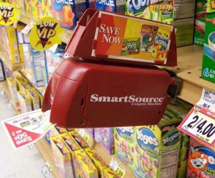 A SmartSource coupon machine in a grocery aisle, representing life in the 90s.