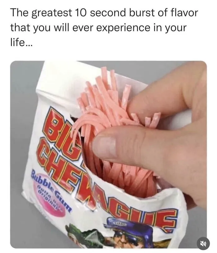 A hand pulling out strands of Big League Chew bubble gum, a classic treat from life in the 90s.