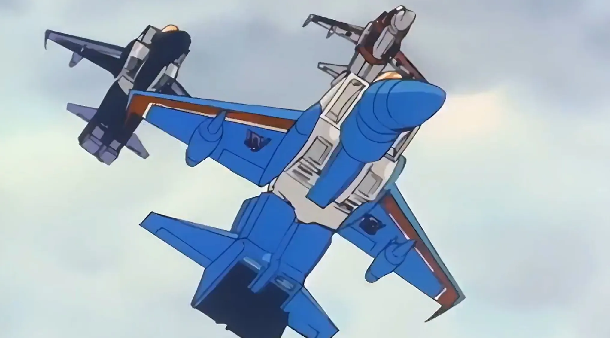 Saturday Morning Cartoon Trivia: Still from a cartoon intro showing two Transformers jet characters in flight.